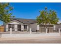 Charming single-Gathering home featuring well-maintained landscaping, a spacious driveway, and a welcoming two-car garage at 1408 E Carson Rd, Phoenix, AZ 85042