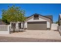 Charming single-Gathering home featuring well-maintained landscaping, a spacious driveway, and a welcoming two-car garage at 1408 E Carson Rd, Phoenix, AZ 85042
