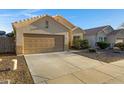 A single-story home with a two-car garage and desert landscaping visible at 2629 E Hidalgo Ave, Phoenix, AZ 85040