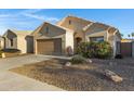 Single-story home showcasing a two-car garage and low-maintenance desert landscaping at 2629 E Hidalgo Ave, Phoenix, AZ 85040