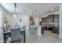 Open-concept kitchen with stainless steel appliances and island seating at 3661 E Appaloosa Dr, San Tan Valley, AZ 85140