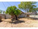 Cozy single-story home with a stone facade, light siding and drought tolerant landscaping at 452 S Horne --, Mesa, AZ 85204