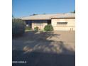 Classic desert home featuring mature landscaping, offering comfortable suburban living with a welcoming front entrance at 4613 N 24Th Pl, Phoenix, AZ 85016