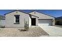 Charming single-story home with a two car garage, desert landscaping, and neutral paint at 47219 W Pecan Woods --, Maricopa, AZ 85139