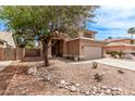 Attractive single Gathering house with rock landscaping, mature trees and a view of the front entrance at 4757 E Goldfinch Gate Ln, Phoenix, AZ 85044