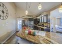 Modern kitchen boasts granite countertops, stainless steel appliances, and decorative lighting at 538 E Rockwood Dr, Phoenix, AZ 85024