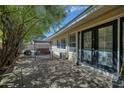 Inviting patio with beautiful stone pavers, outdoor swing, and lots of shade at 7001 E Flossmoor Ave, Mesa, AZ 85208