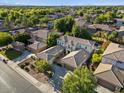 Beautiful aerial view of home showcasing its prime location, three car garage and neighborhood at 834 W Whitten St, Chandler, AZ 85225