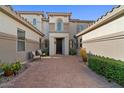 Stunning courtyard showcasing a welcoming entrance, lush greenery, and seating area at 834 W Whitten St, Chandler, AZ 85225