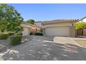 Spacious home featuring a three-car garage, desert landscaping and large driveway at 834 W Whitten St, Chandler, AZ 85225