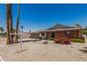 Single Gathering home featuring a brick exterior, low maintenance landscaping, and a two car garage at 855 S Revolta Cir, Mesa, AZ 85208