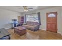 Bright living room with hardwood floors, large window, and a cozy seating area at 101 W 8Th Pl, Mesa, AZ 85201