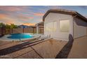 Backyard pool and covered patio with mountain views at 10276 E Meandering Trail Ln, Gold Canyon, AZ 85118