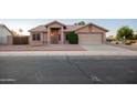 Charming single-story home with a well-maintained front yard and two car garage at 1220 S Wagon Wheel Dr, Chandler, AZ 85286