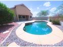 Backyard pool with a view of the home's rear exterior at 1248 W Deoni Trl, San Tan Valley, AZ 85143
