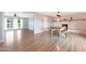 Open floorplan featuring hardwood floors, fireplace, dining and living room at 12627 N 25Th Ave, Phoenix, AZ 85029