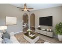 Stylish living area with a comfortable sofa, modern decor, and an inviting atmosphere for relaxation at 14234 N 26Th Ln Ln, Phoenix, AZ 85023