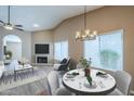 Open-concept living space featuring a dining area, vaulted ceiling, and seamless flow for entertaining at 14234 N 26Th Ln Ln, Phoenix, AZ 85023
