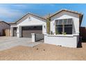 Attractive single-story home featuring a 3-car garage and drought-tolerant landscaping at 17084 N Palo Pino St, Maricopa, AZ 85138