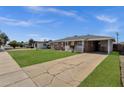 Charming home offers a well-maintained lawn, classic brick exterior, and a covered carport for added convenience at 1944 W Osborn Rd, Phoenix, AZ 85015