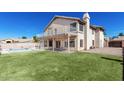 Large backyard featuring a covered patio, pool, and grassy area; ideal for outdoor activities and entertaining at 3761 W Kent Dr, Chandler, AZ 85226