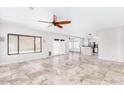 Light-filled living room with windows, patio doors, and tile flooring, perfect for relaxing or hosting gatherings at 3761 W Kent Dr, Chandler, AZ 85226