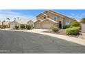 Beautiful desert home with a three-car garage and low maintenance landscaping at 4207 E Rockledge Rd, Phoenix, AZ 85044