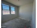 Bedroom with two large windows bringing in natural light at 47230 W Cansados Rd, Maricopa, AZ 85139