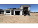 New home with garage under construction showing unfinished exterior and roof tiles at 47230 W Cansados Rd, Maricopa, AZ 85139