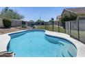 Private pool with a surrounding fence for added safety in backyard at 6742 W El Cortez Pl, Peoria, AZ 85383