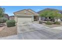 Attractive single-story home featuring a two-car garage, low-maintenance landscaping, and a covered entryway at 7236 W Townley Ave, Peoria, AZ 85345