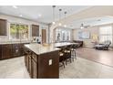 Spacious kitchen with granite countertops, a large island, stainless steel appliances, and ample seating at 9132 S Parkside Dr, Tempe, AZ 85284