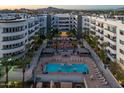 Captivating aerial view of apartment complex highlighting a pristine pool, cabanas, and manicured landscaping at 945 E Playa Del Norte Dr # 1022, Tempe, AZ 85288