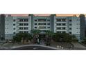 Well-maintained apartment building exterior with elegant landscaping and a welcoming entrance at 945 E Playa Del Norte Dr # 1022, Tempe, AZ 85288
