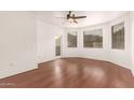 Bright, spacious bedroom with beautiful wood-look floors and a ceiling fan at 9820 N Central Ave # 307, Phoenix, AZ 85020
