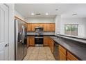 Well-equipped kitchen with stainless steel appliances, and dark countertops at 10152 E Knowles Ave, Mesa, AZ 85209