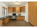 Bright office with built-in cabinets and desk, perfect for a home workspace at 10152 E Knowles Ave, Mesa, AZ 85209