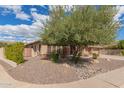 Charming single-story home featuring desert landscaping and an inviting front facade with lots of curb appeal at 104 E Louis Way, Tempe, AZ 85284