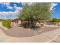 Charming single-story home featuring desert landscaping and an inviting front facade with lots of curb appeal at 104 E Louis Way, Tempe, AZ 85284