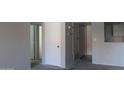 Neutral tones enhance the carpeted hallway featuring multiple doors and easy kitchen access at 11011 N 92Nd St # 1096, Scottsdale, AZ 85260