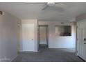 Neutral tones throughout living room offers versatile space with a pass-through to the kitchen at 11011 N 92Nd St # 1096, Scottsdale, AZ 85260