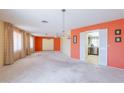 Open living space leads into adjacent kitchen featuring white appliances at 1156 E Brenda Dr, Casa Grande, AZ 85122