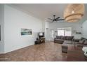Open-concept living room offering bright natural light, high ceilings, and access to the back yard patio at 13034 W Cheery Lynn Rd, Avondale, AZ 85392