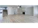 Bright, open living room features new flooring, a fireplace, and a staircase at 1361 E Sheffield Ave, Gilbert, AZ 85296