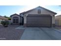 Beautiful single-story home with a well-maintained front yard and a two-car garage at 14968 N 134Th Ln, Surprise, AZ 85379