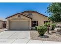 Attractive single-story home featuring a low maintenance front yard and an attached two-car garage at 16675 W Taylor St, Goodyear, AZ 85338