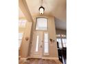 View of the entryway with high ceilings, clerestory windows, and decorative lighting features at 1681 S Karen Dr, Chandler, AZ 85286