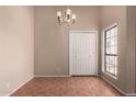 Dining room with a chandelier, neutral walls, and tile flooring at 1976 N Lemon Tree Ln # 16, Chandler, AZ 85224