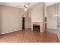 Spacious living area featuring a fireplace, tile flooring, and neutral colored walls at 1976 N Lemon Tree Ln # 16, Chandler, AZ 85224