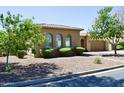 Inviting single-story home featuring desert landscaping, a neutral color palette, and a well-maintained front yard at 20243 E Poco Calle --, Queen Creek, AZ 85142